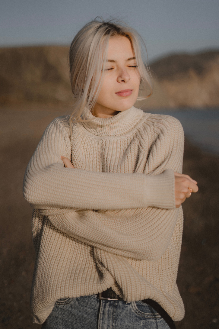 Photo of Woman Wearing Beige Sweater