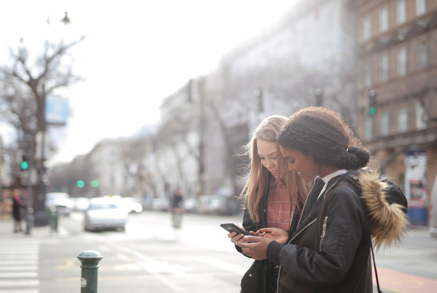 Women Looking At Mobile Phone